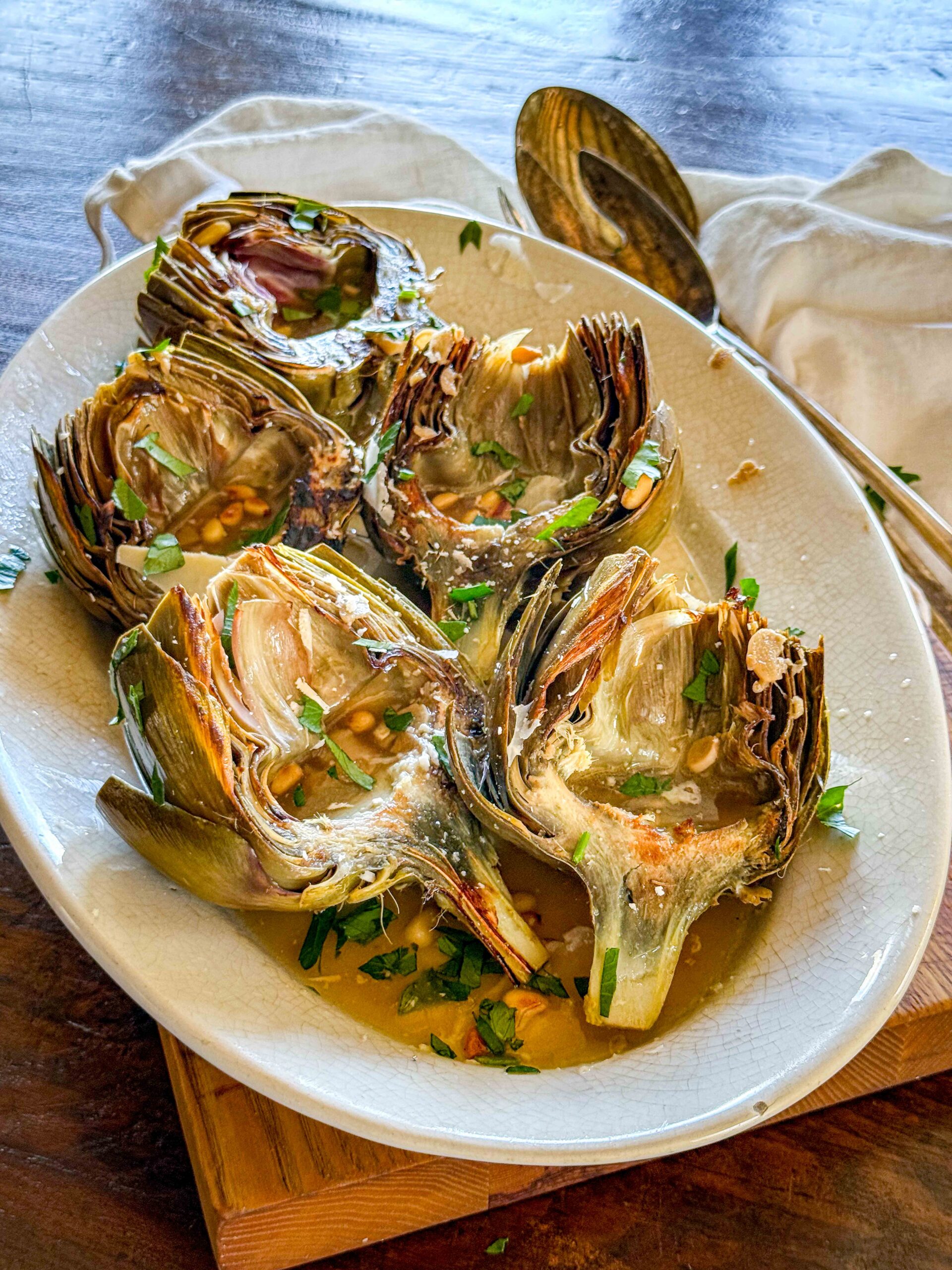 Braised Artichokes with Pecorino and Pine Nuts